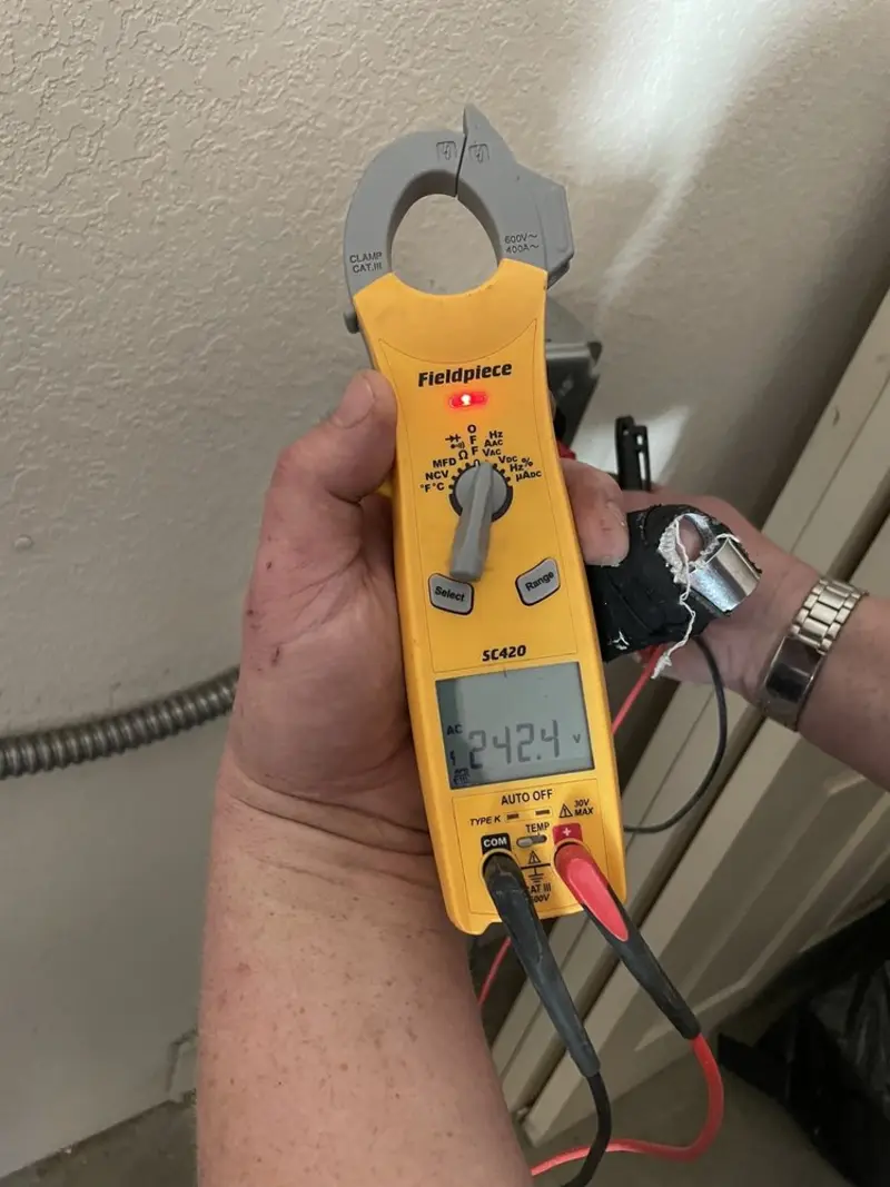 Voltage testing with clamp meter during Generator Installation in Sandpoint